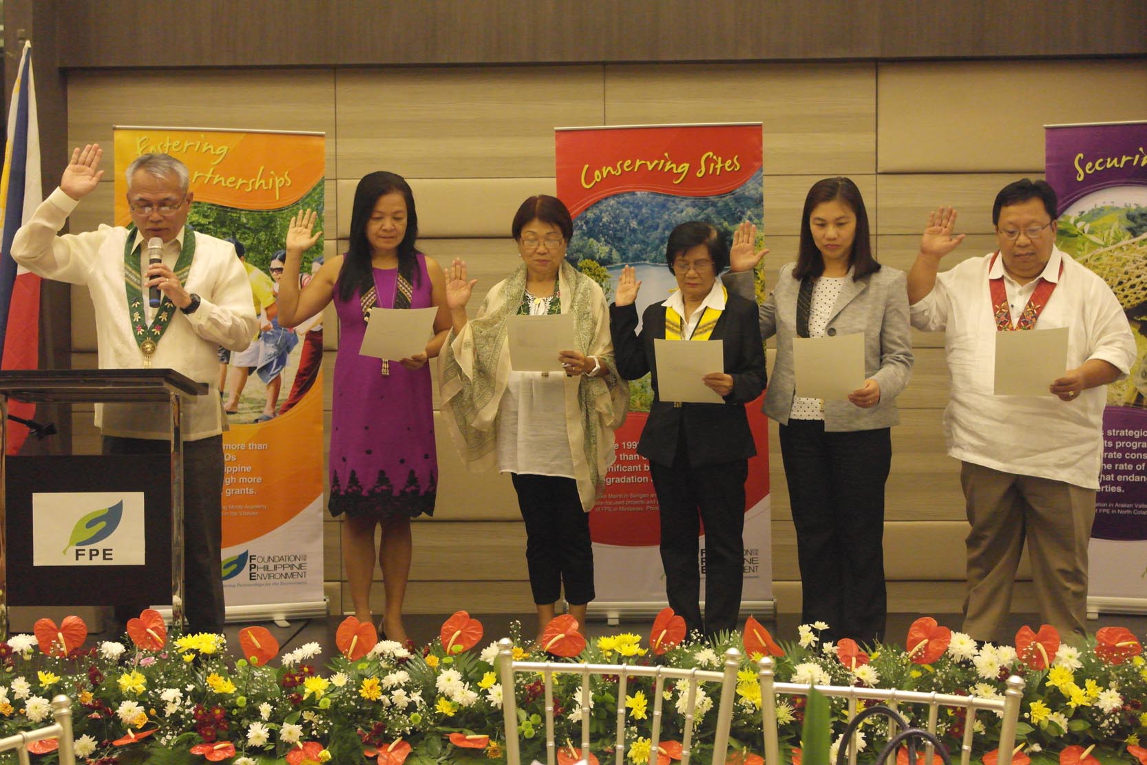 Immediate past Chair and CEO Nestor Carbonera (leftmost) led the induction of new members of FPE Board of Trustees (L-R): Dr. Lourdes Simpol, Dr. Paciencia Milan, Ms. Wilhelmina Gonzales, Atty. Francisca Claver, and Engr. Pipalawan Naga